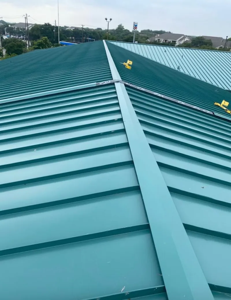 Green commercial metal roof ridge and valley for Metal Roof Repair in Watertown